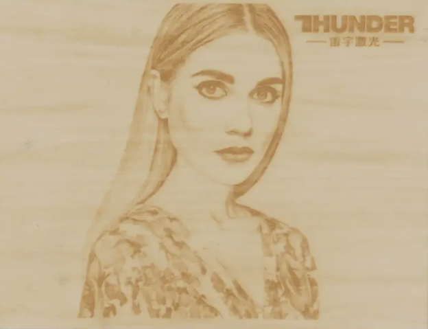Completed laser-engraved photograph on wood