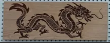 Deep engraved dragon on cherry wood. Deep engraved dragon on cherry wood.