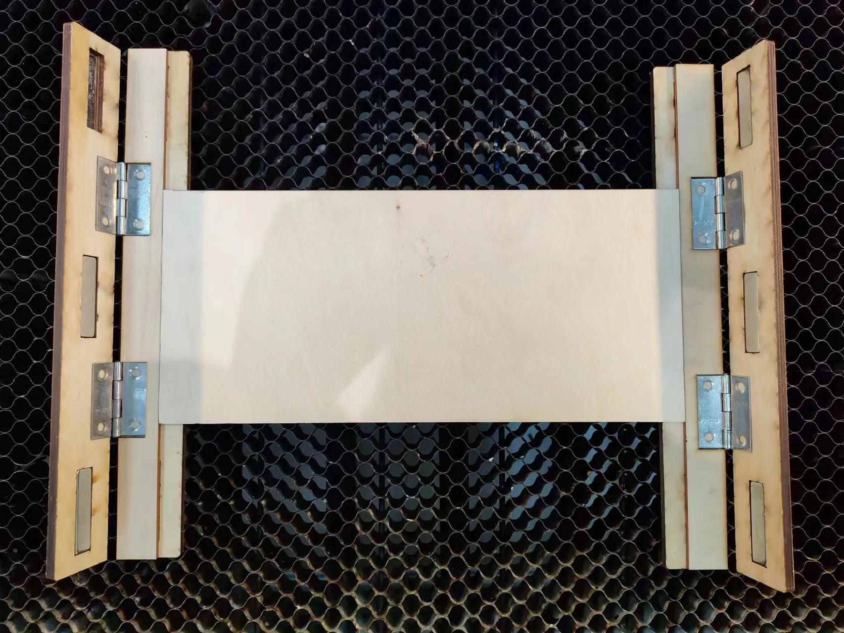 1779785197393335.jpeg Wood clamp holding material flat
