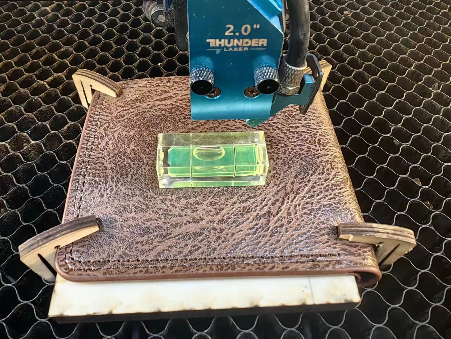 1779785355988142.jpeg Checking custom mold flatness with a level