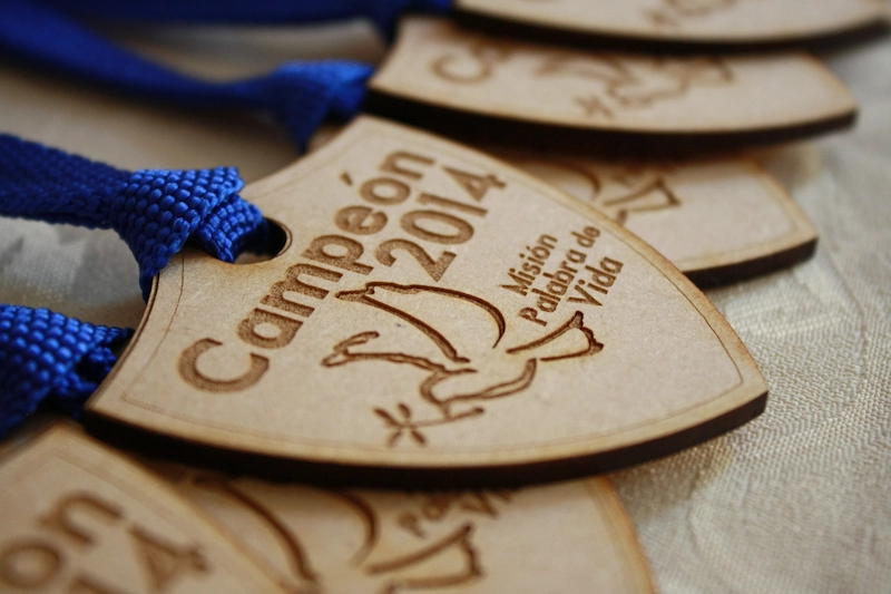 Laser-cut and engraved MDF medals for a STEAM classroom project