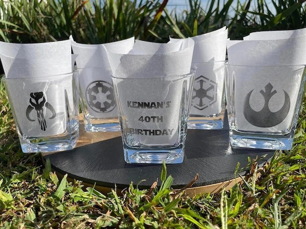 Laser engraved glass cups, wine glasses, and drinkware with custom designs