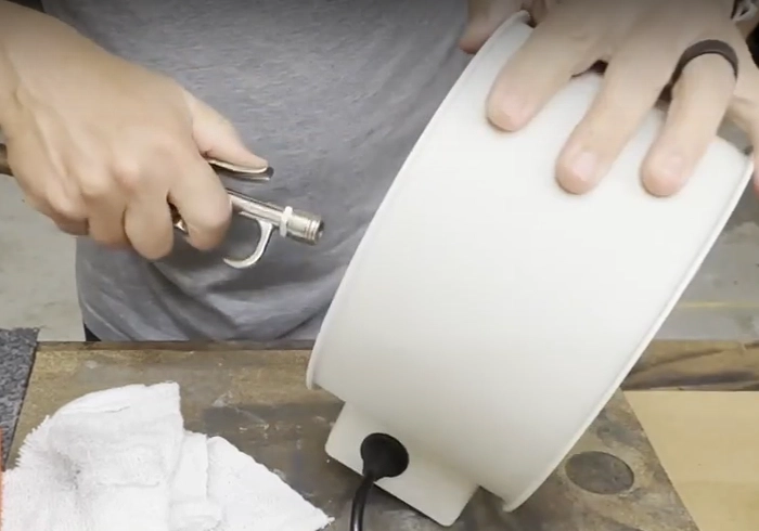 Blow dust off the exhaust fan with an air gun