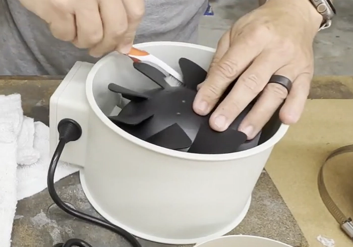 Clean the exhaust fan blades with a brush
