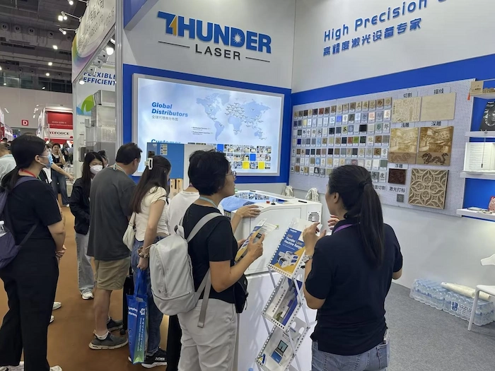 Visitors learning about Thunder Laser machines at the Canton Fair