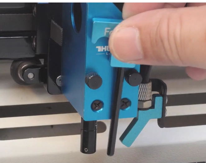 Placing the Bolt manual focus tool on the laser head
