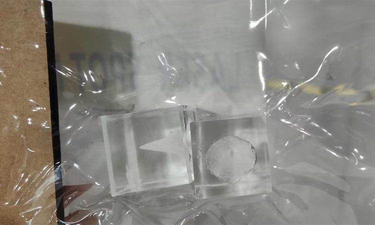 Laser beam acrylic testing for glass laser tube quality