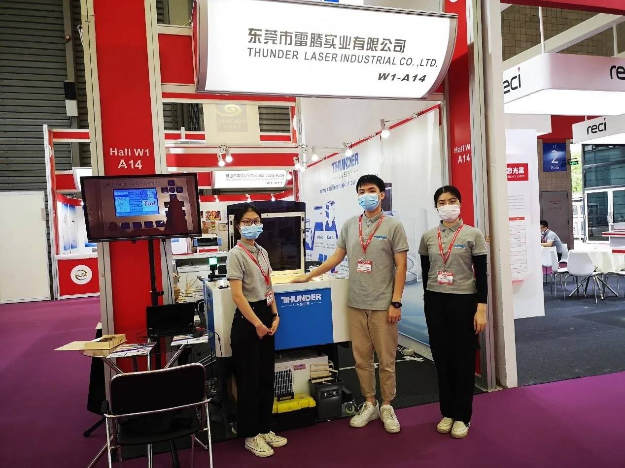 Thunder Laser team showcasing our equipment and output at an expo