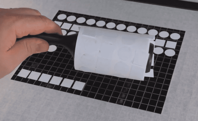 roller to collect abs laser fragment