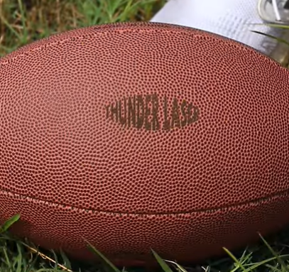 A well laser engraved football made with thunder bolt pro 22