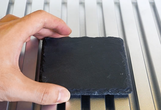 Place the slate on the laser bed