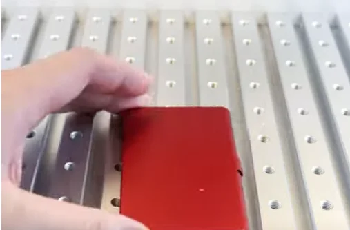 anodized aluminum business card holder on laser bed