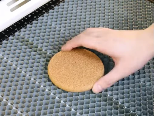 put a cork coaster on laser honeycomb bed
