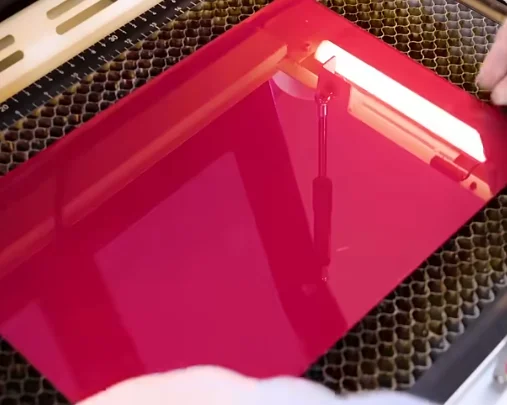 red acrylic on laser honeycomb bed
