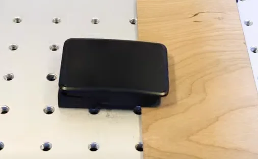 place a wooden block underneath belt buckle to keep it level