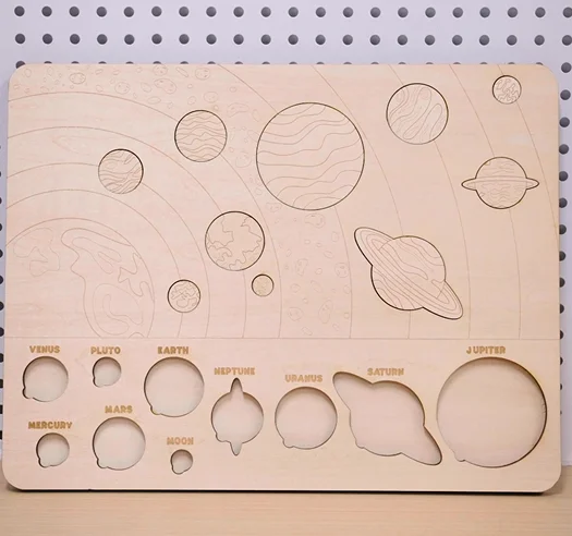 An educational toy wood planet puzzle is done with thunder bolt
