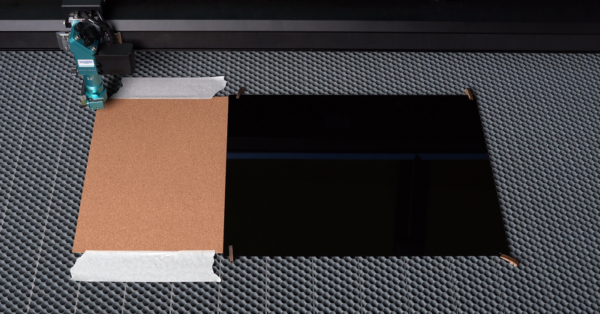 2 mm softwood and 3mm acrylic are put on the laser table