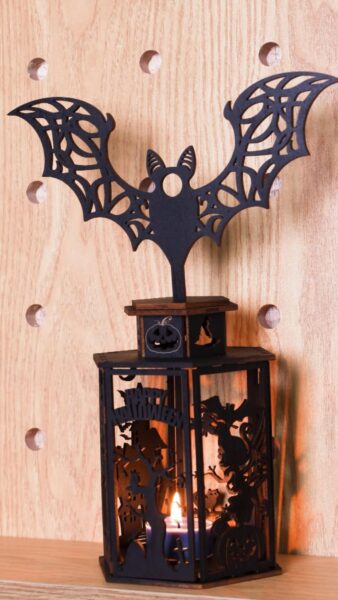 A well laser cut candle holder made with thunder bolt
