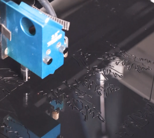 laser cutting the acrylic for making a wall art