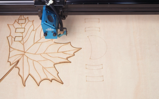 laser cutting the maple leaf shape calendar