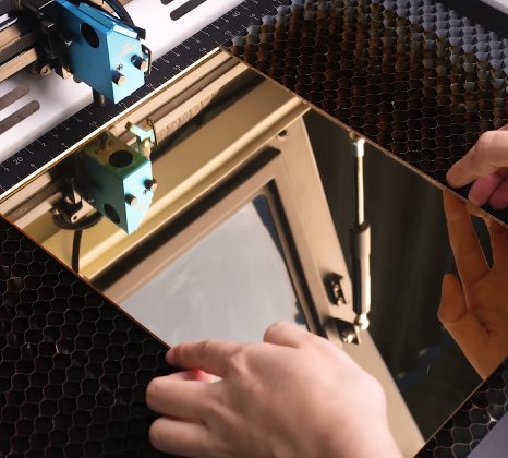 Place the mirror acrylic on the laser bed