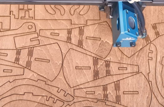 laser cutting a wooden phonograph