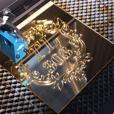 Laser cutting black acrylic for making a special door sign