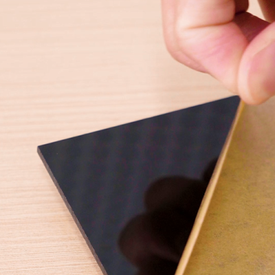 Peel the film off before laser cutting the acrylic