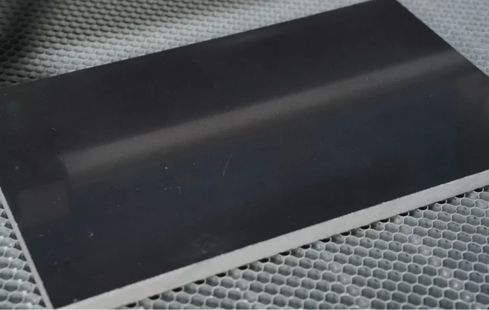 Placing marble on laser engraving machine work area