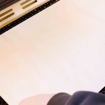 Put the wood onto the work bed