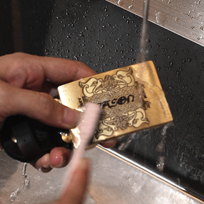 Wash the laser marked brass belt buckle with water and a toothbrush