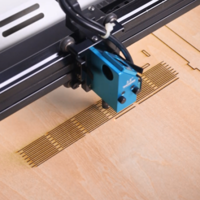 laser cutting the wood for making a tool kit